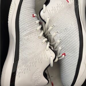 Jordan White and Black Athletic Shoes with Red Accents